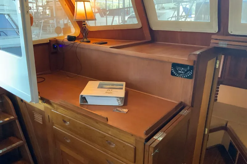 Slide: The Image of 1976 Cheoy Lee 40 LRC interior with wooden cabinetry and a lamp. - 32