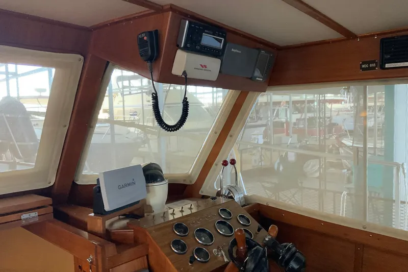 Slide: The Image of 1976 Cheoy Lee 40 LRC helm with navigation equipment and wooden dashboard. - 35