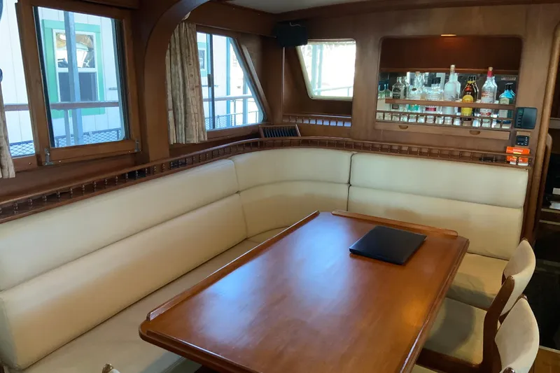Slide: The Image of 1976 Cheoy Lee 40 LRC yacht interior with dining area and bar. - 38