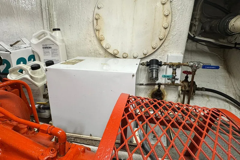 Slide: The Image of Engine room of 1976 Cheoy Lee 40 LRC with equipment and maintenance supplies. - 55