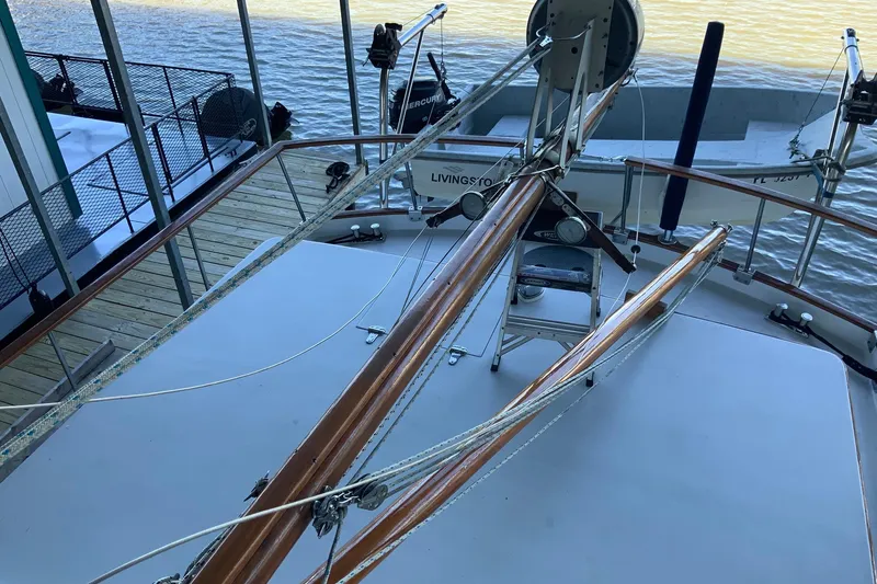 Slide: The Image of 1976 Cheoy Lee 40 LRC yacht deck with wooden railings and rigging. - 6