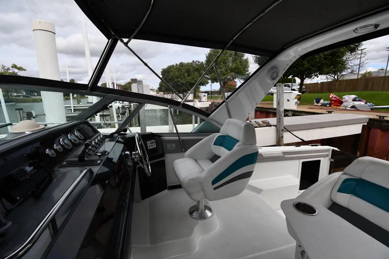 Slide: The Image of Interior of a 1990 Formula boat with modern seating and control panel. - 12