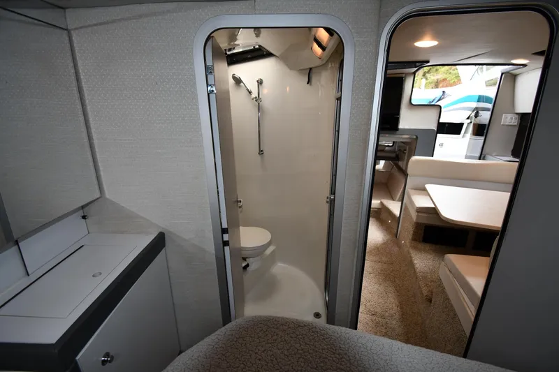 Slide: The Image of 1990 Formula boat interior with bathroom, dining area, and modern furnishings. - 24