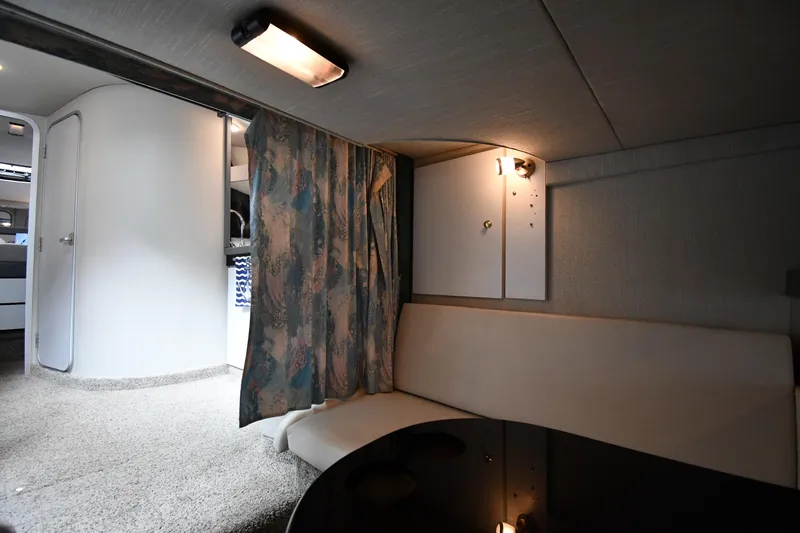 Slide: The Image of 1990 Formula boat interior with seating, curtain, and lighting. - 37