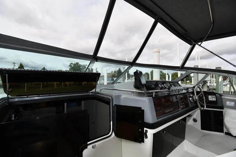 Slide: The Image of Interior of a 1990 Formula boat cockpit with steering wheel and control panel. - 9