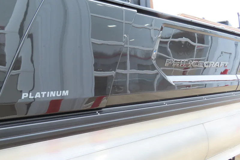 Slide: The Image of 2025 Princecraft Vogue 25 RL boat, platinum finish, close-up view. - 21