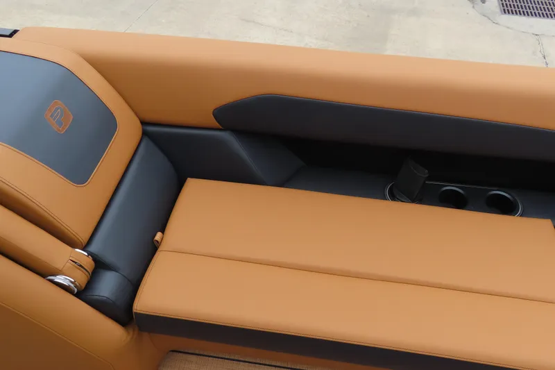 Slide: The Image of Luxurious tan and black seating in 2025 Princecraft Vogue 25 RL boat. - 23