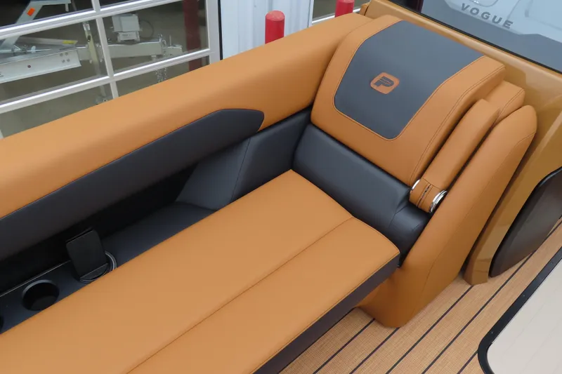 Slide: The Image of Luxurious seating on 2025 Princecraft Vogue 25 RL boat, featuring tan and black upholstery. - 24