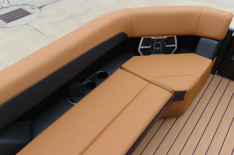 Slide: The Image of Luxurious seating on 2025 Princecraft Vogue 25 RL boat with tan upholstery and cup holders. - 26
