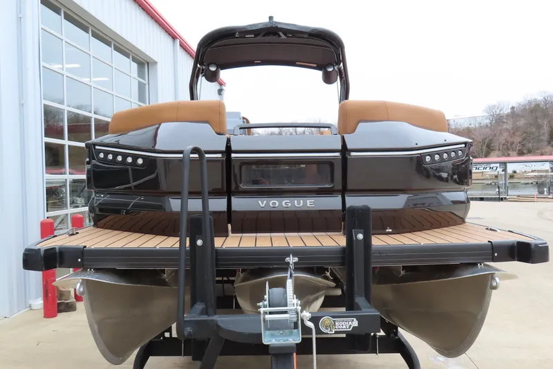 Slide: The Image of 2025 Princecraft Vogue 25 RL pontoon boat, rear view at a marina. - 3