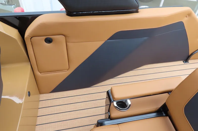 Slide: The Image of 2025 Princecraft Vogue 25 RL interior with tan and black seating, cup holder, and sleek design. - 33