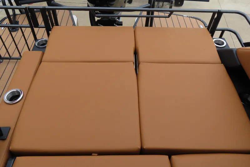 Slide: The Image of 2025 Princecraft Vogue 25 RL boat with tan cushioned seating and cup holders. - 35