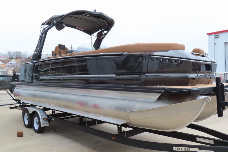 Slide: The Image of 2025 Princecraft Vogue 25 RL pontoon boat on trailer, featuring sleek design and modern amenities. - 4