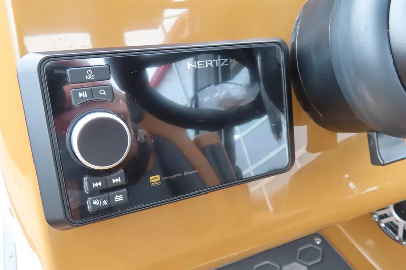 Slide: The Image of Hertz audio system on 2025 Princecraft Vogue 25 RL boat dashboard. - 44