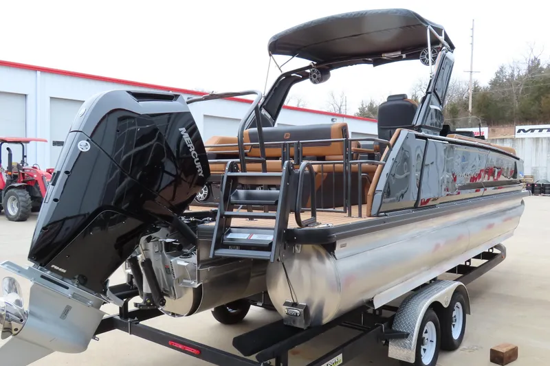 Slide: The Image of 2025 Princecraft Vogue 25 RL pontoon boat with Mercury outboard engine on trailer. - 5