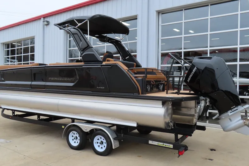 Slide: The Image of 2025 Princecraft Vogue 25 RL pontoon boat with Mercury engine on trailer. - 8