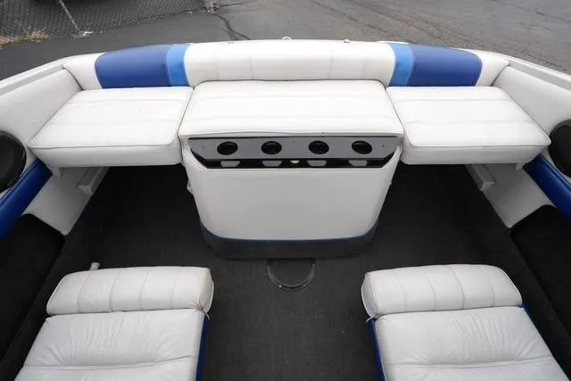 Slide: The Image of 1992 Celebrity 180 Bowrider boat interior with white and blue seating. - 16