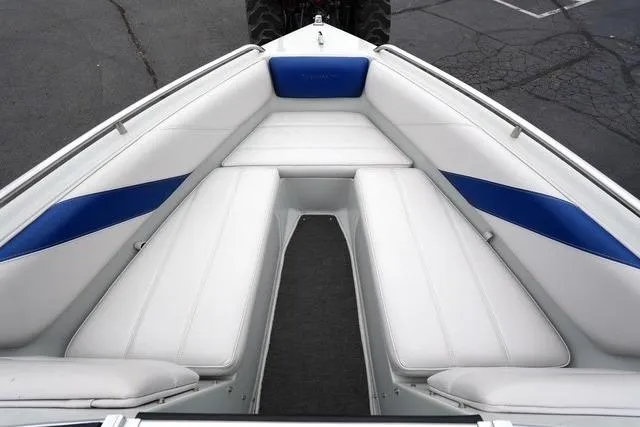 Slide: The Image of 1992 Celebrity 180 Bowrider boat interior with white and blue seating. - 8