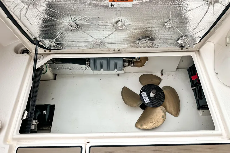 Slide: The Image of 2022 Cutwater 30 Command Bridge engine compartment with propeller and insulation. - 11