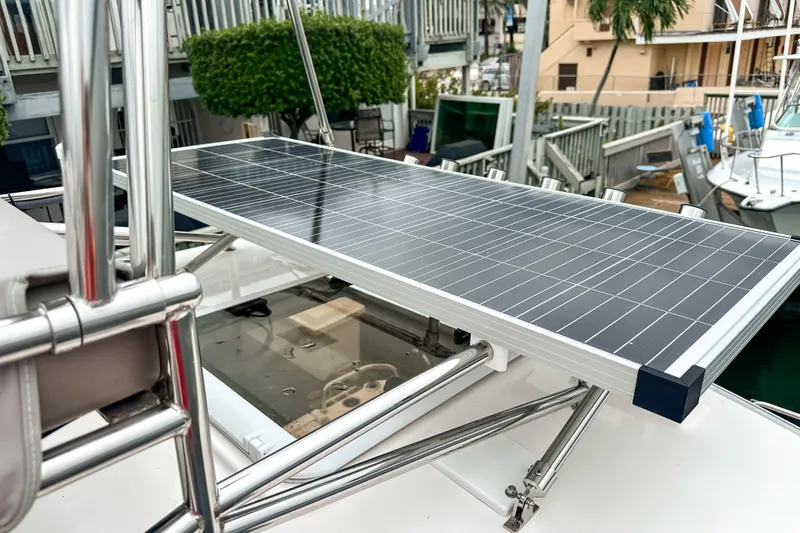 Slide: The Image of Solar panel on 2022 Cutwater 30 Command Bridge boat, docked near marina. - 12