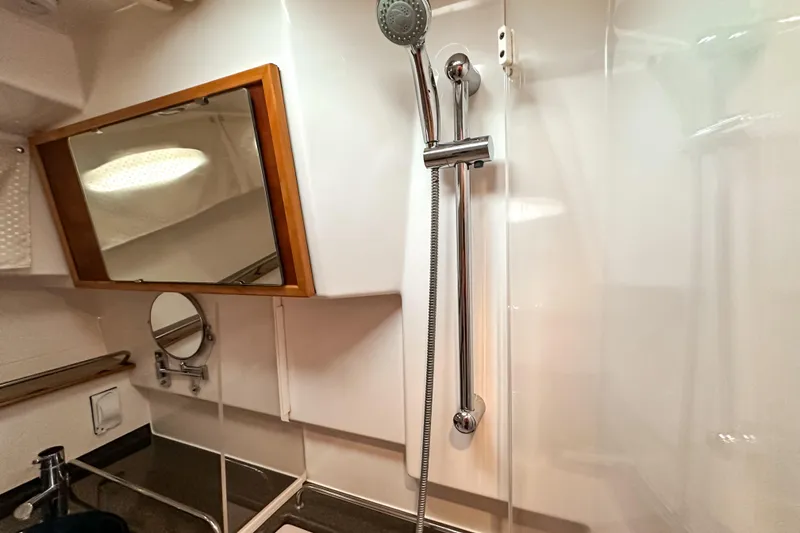 Slide: The Image of Bathroom interior of 2022 Cutwater 30 Command Bridge with shower and mirrors. - 35