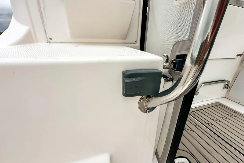 Slide: The Image of 2022 Cutwater 30 Command Bridge boat interior with Fusion audio system and stainless steel railing. - 48