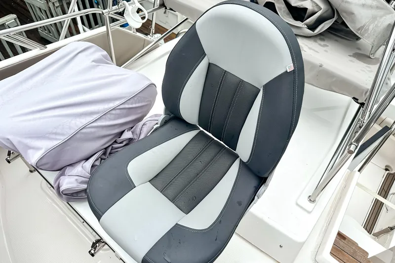 Slide: The Image of 2022 Cutwater 30 Command Bridge boat seat, featuring sleek black and gray design. - 51