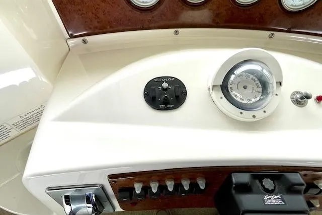 Slide: The Image of Control panel of a 2002 Silverton 43 Motor Yacht with gauges and switches. - 23
