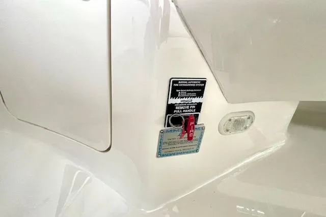 Slide: The Image of 2002 Silverton 43 Motor Yacht safety instructions and emergency handle detail. - 26