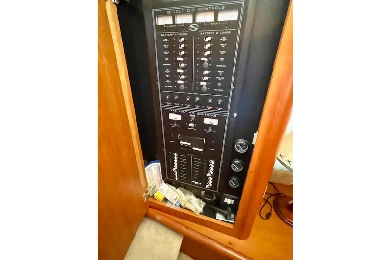 Slide: The Image of Control panel of a 2002 Silverton 43 Motor Yacht, featuring 12-volt DC controls. - 27
