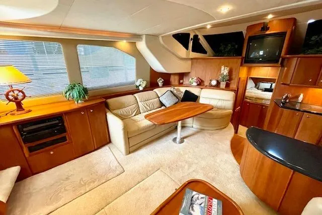 Slide: The Image of Luxurious interior of a 2002 Silverton 43 Motor Yacht with elegant furnishings and decor. - 31