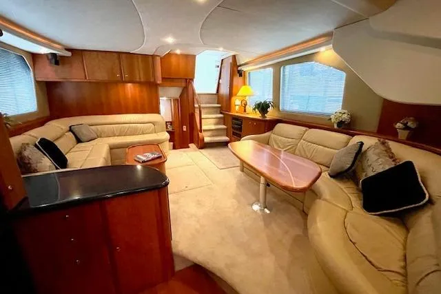 Slide: The Image of Luxurious interior of a 2002 Silverton 43 Motor Yacht with plush seating and elegant decor. - 36