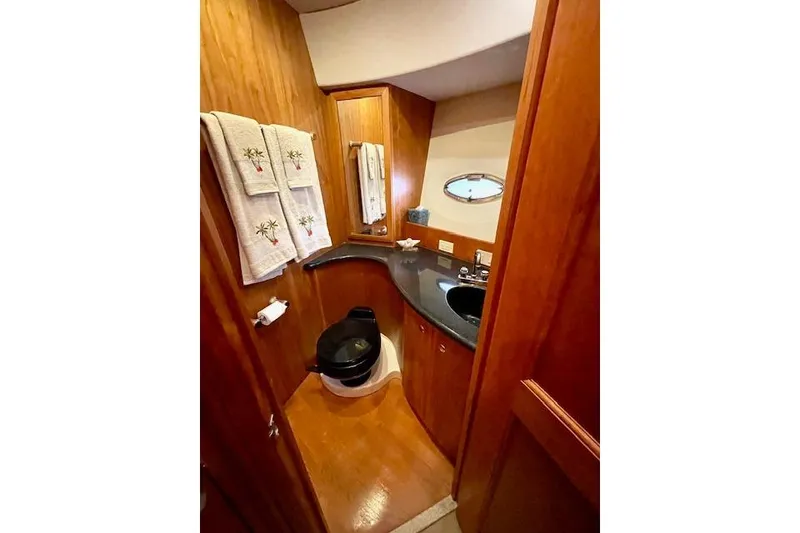 Slide: The Image of Luxurious bathroom in 2002 Silverton 43 Motor Yacht with wood accents and modern fixtures. - 40