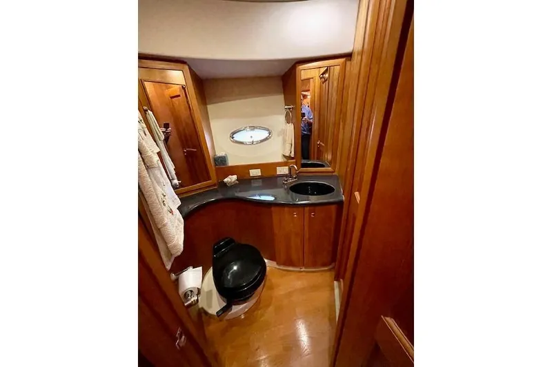 Slide: The Image of Luxurious bathroom in 2002 Silverton 43 Motor Yacht with wood cabinetry and modern fixtures. - 41
