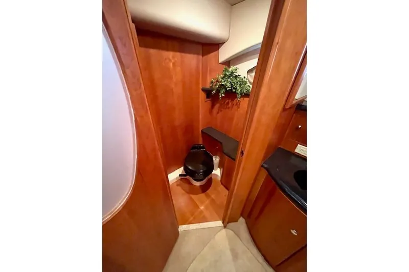 Slide: The Image of Luxurious bathroom in 2002 Silverton 43 Motor Yacht with wood paneling and modern fixtures. - 47