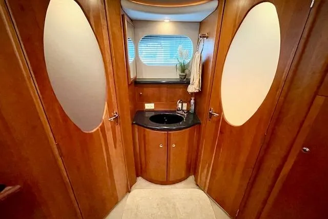Slide: The Image of Luxurious 2002 Silverton 43 Motor Yacht bathroom with wood finish and modern fixtures. - 51