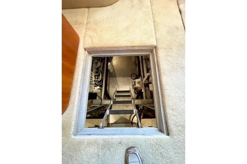 Slide: The Image of Engine room access hatch on 2002 Silverton 43 Motor Yacht, showcasing interior mechanics. - 53