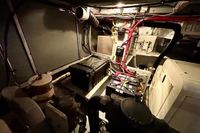 Slide: The Image of Engine room of 2002 Silverton 43 Motor Yacht with visible wiring and components. - 56