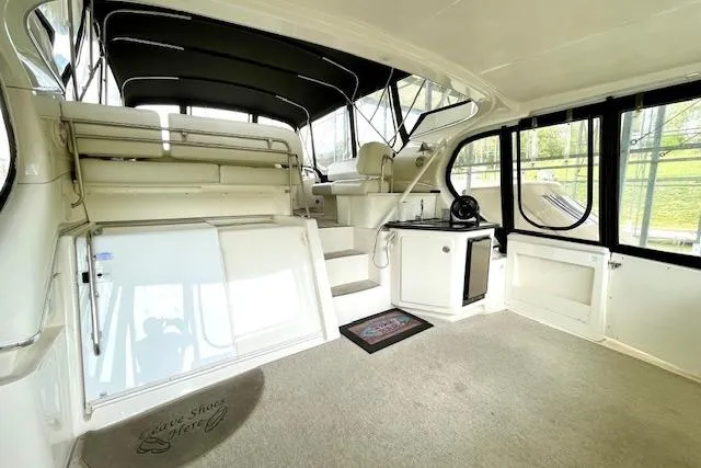 Slide: The Image of 2002 Silverton 43 Motor Yacht interior with spacious seating and modern amenities. - 6