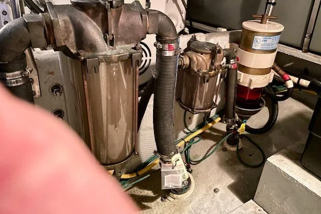 Slide: The Image of Engine room of 2002 Silverton 43 Motor Yacht showing fuel filters and piping. - 61