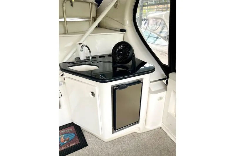 Slide: The Image of 2002 Silverton 43 Motor Yacht interior with kitchenette and mini fridge. - 7