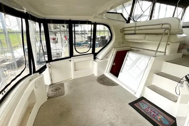 Slide: The Image of 2002 Silverton 43 Motor Yacht interior with carpeted floor and stairs. - 8