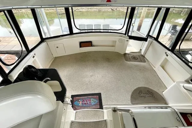 Slide: The Image of Interior of 2002 Silverton 43 Motor Yacht with spacious seating and panoramic windows. - 9