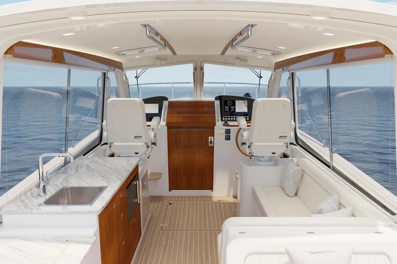 Slide: The Image of Luxurious interior of 2026 MJM 38RS yacht with modern helm and elegant seating. - 1