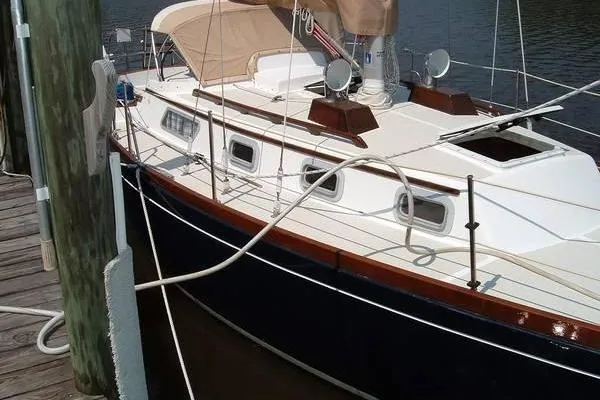 Slide: The Image of 1985 Bristol 31.1 Keel Center Board sailboat docked, featuring classic design and sleek lines. - 6