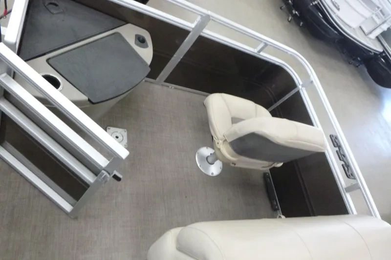 Slide: The Image of 2024 Sun Tracker SportFish 20 DLX interior with seating and storage area. - 12