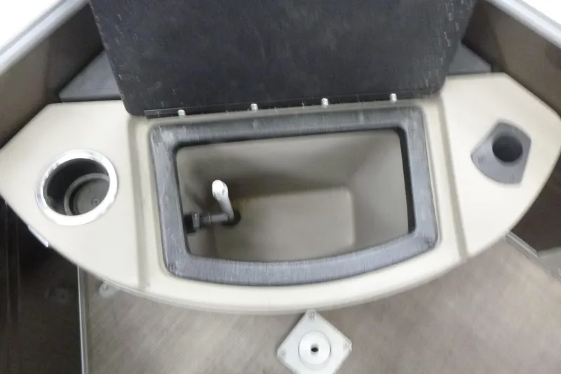Slide: The Image of 2024 Sun Tracker SportFish 20 DLX boat interior storage compartment with cup holders. - 13