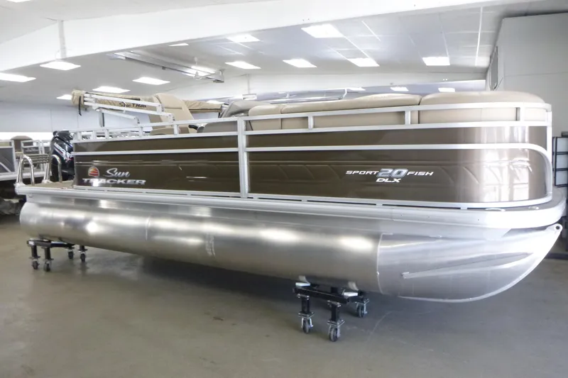 Slide: The Image of 2024 Sun Tracker SportFish 20 DLX pontoon boat in showroom. - 3