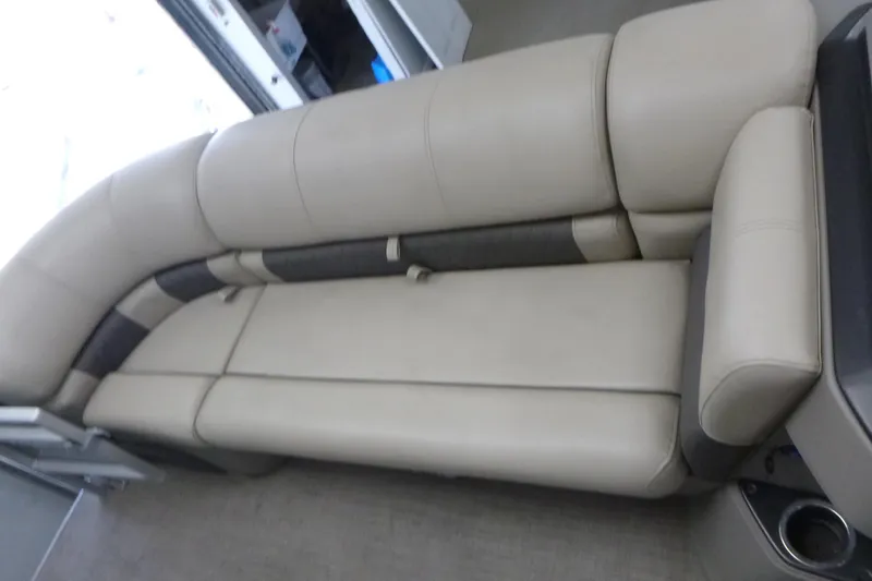 Slide: The Image of 2024 Sun Tracker SportFish 20 DLX boat interior with beige cushioned seating. - 9