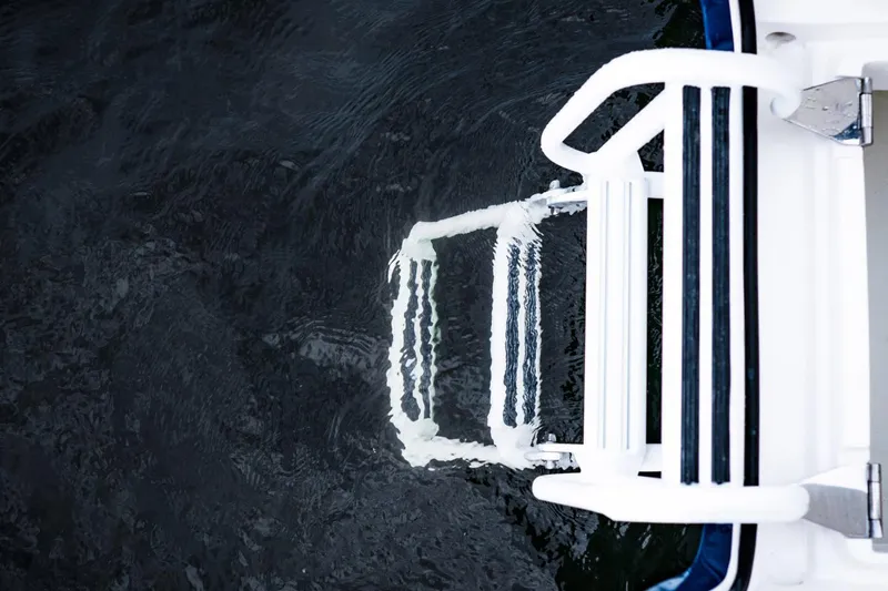 Slide: The Image of 2022 Intrepid 327-I CC boat interior with seating and rod holders. - 18